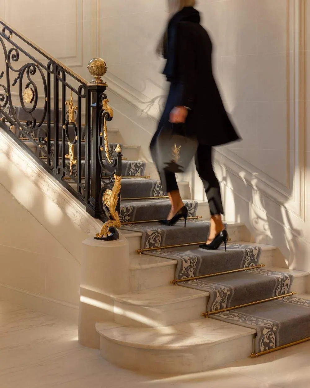 Grand staircase with its original wrought-iron banister — Maison Bauchart