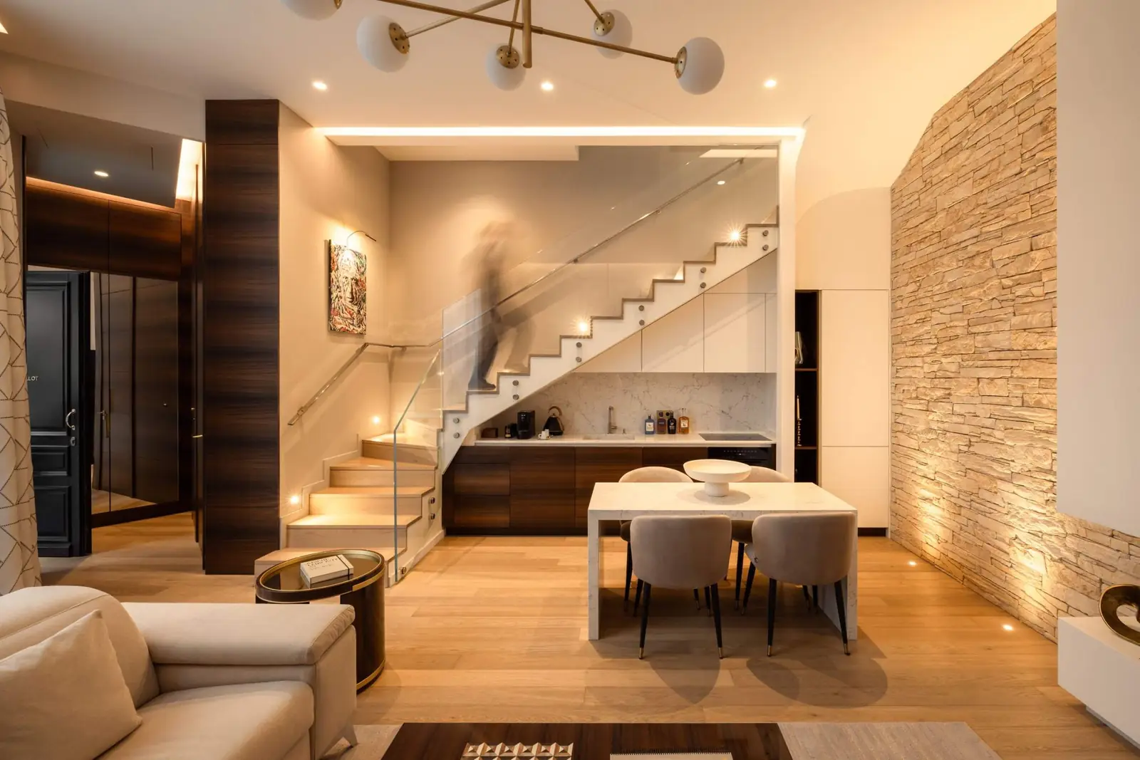 Chaillot Duplex Loft, the duplex, staircase and stone wall — Maison Bauchart, Paris 8th