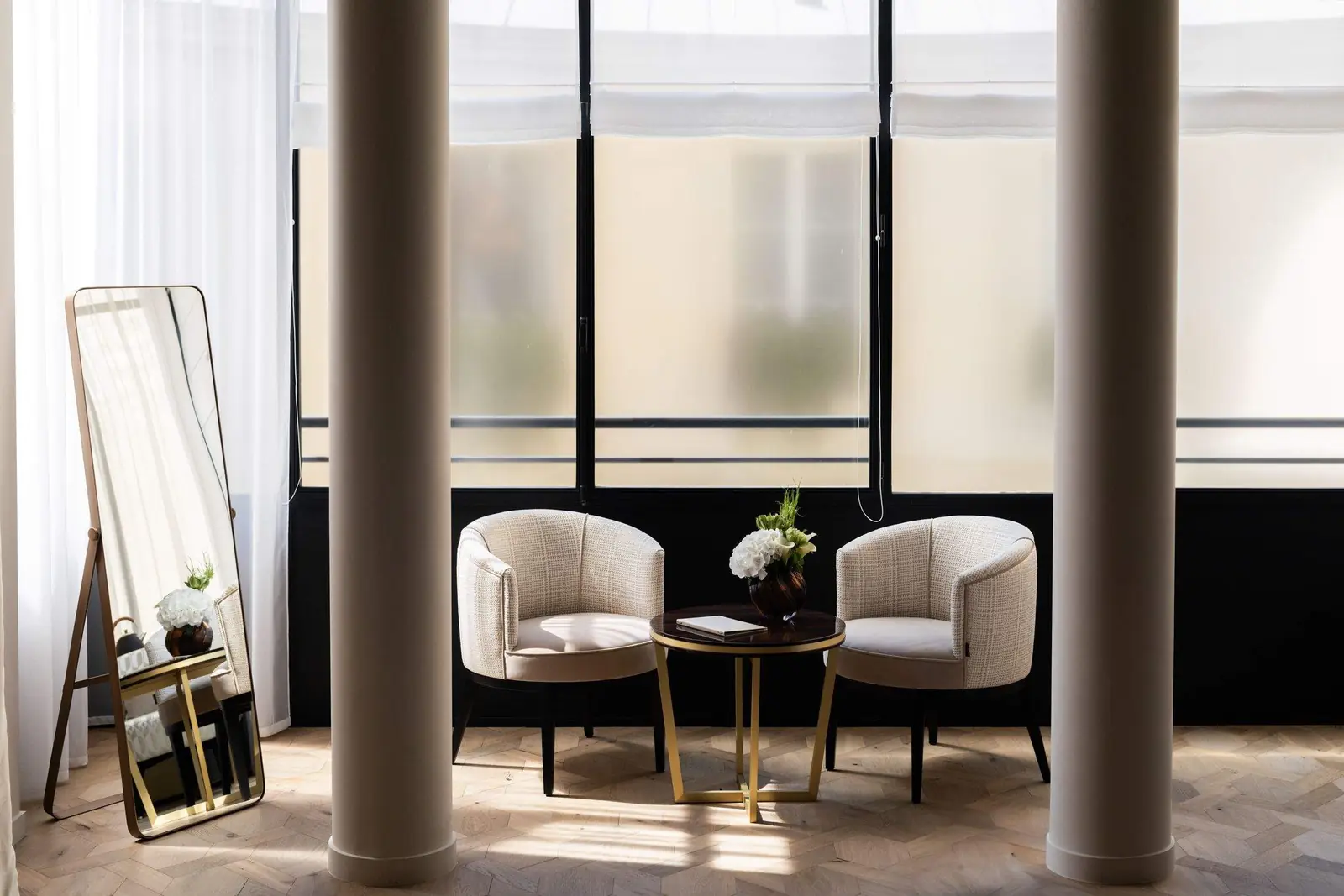 Columns and tall windows in the Elysée Suite — Maison Bauchart