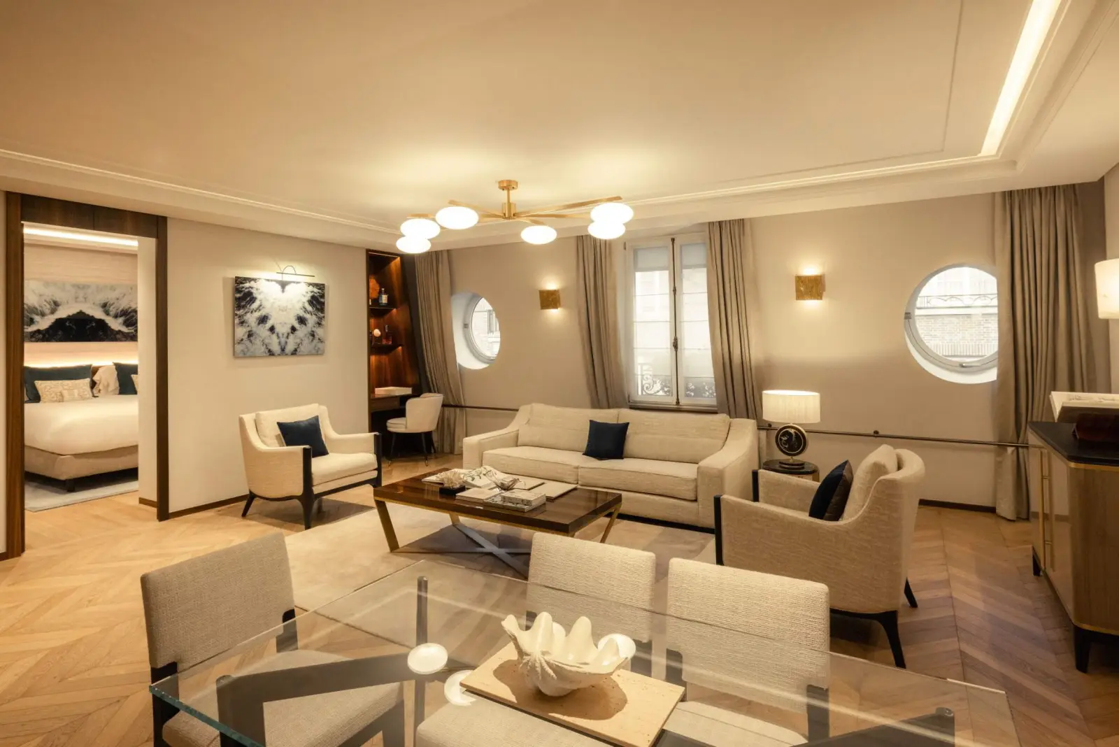 Magellan Suite, the living room and its two portholes — Maison Bauchart, Paris 8th