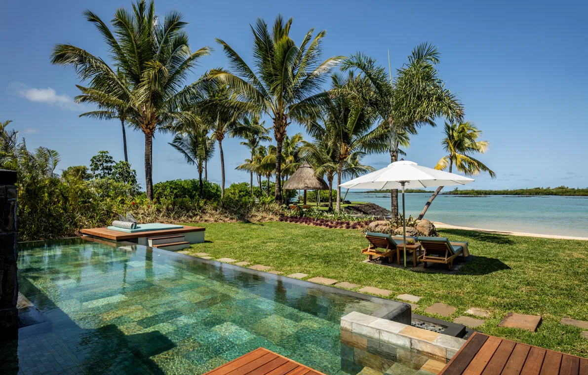 Pool of a Four Seasons villa at Anahita opening onto the lagoon and the beach
