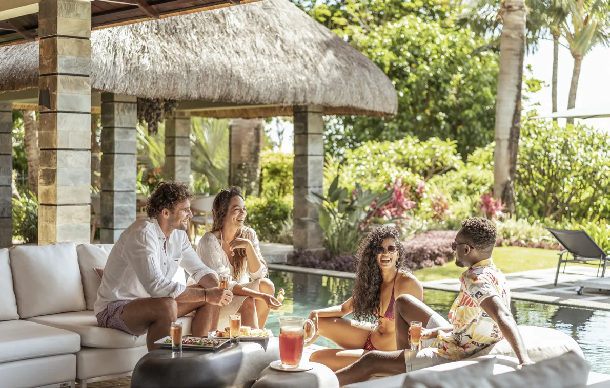 Thatched pavilion and garden of a Four Seasons villa at Anahita