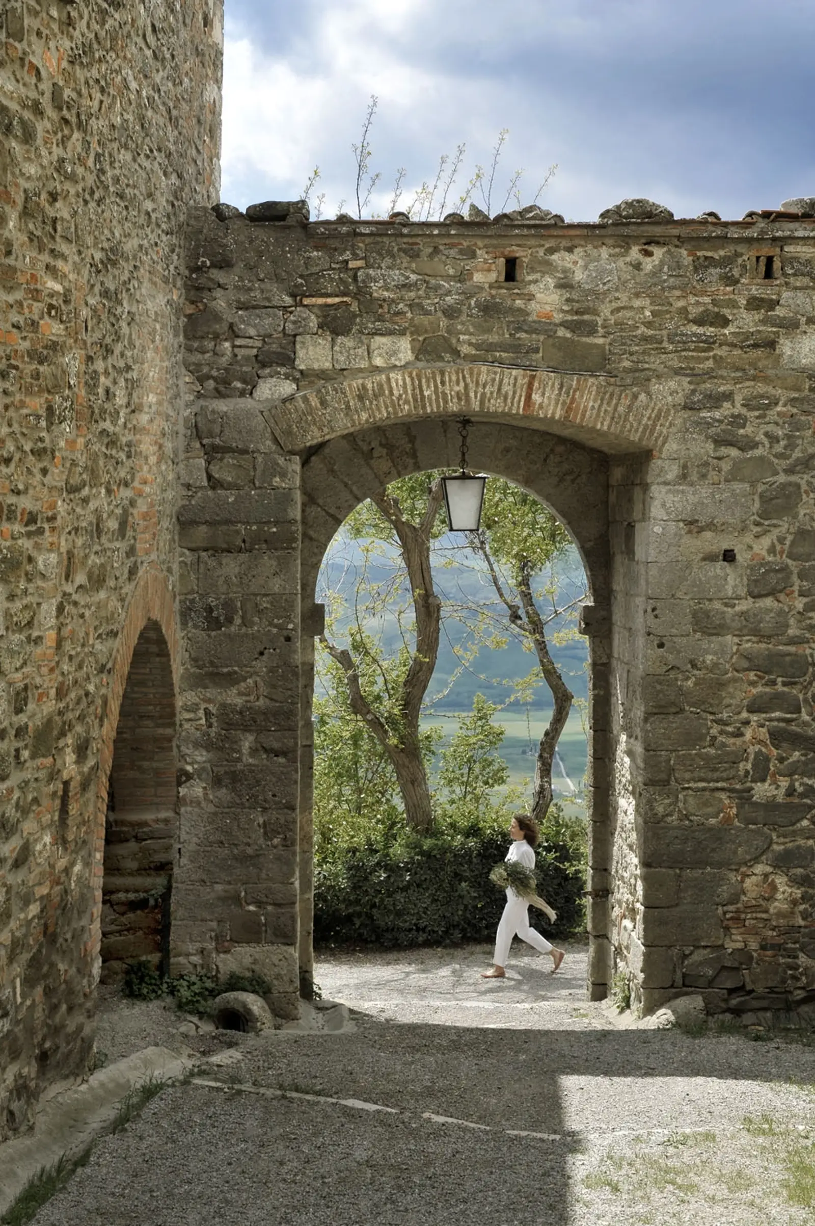 Stone archway in the medieval village of Monteverdi Tuscany