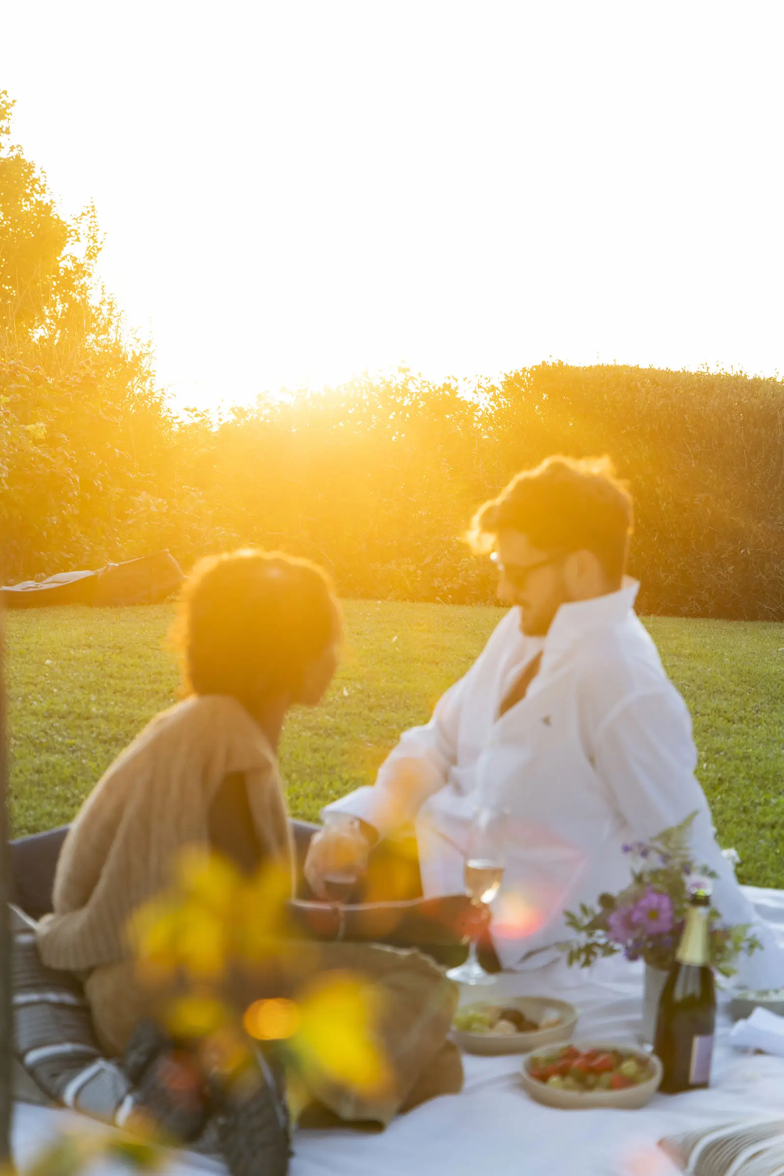 One long table at sunset in the gardens