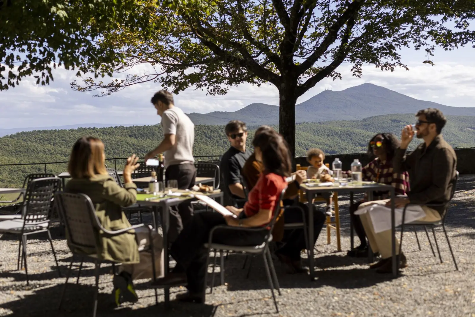 The village piazza under its tree — where vows are said