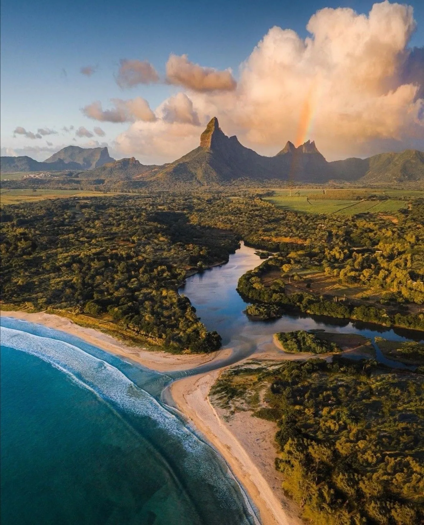 Aerial view of Tamarin Bay, beach, river and Montagne du Rempart, west coast of Mauritius