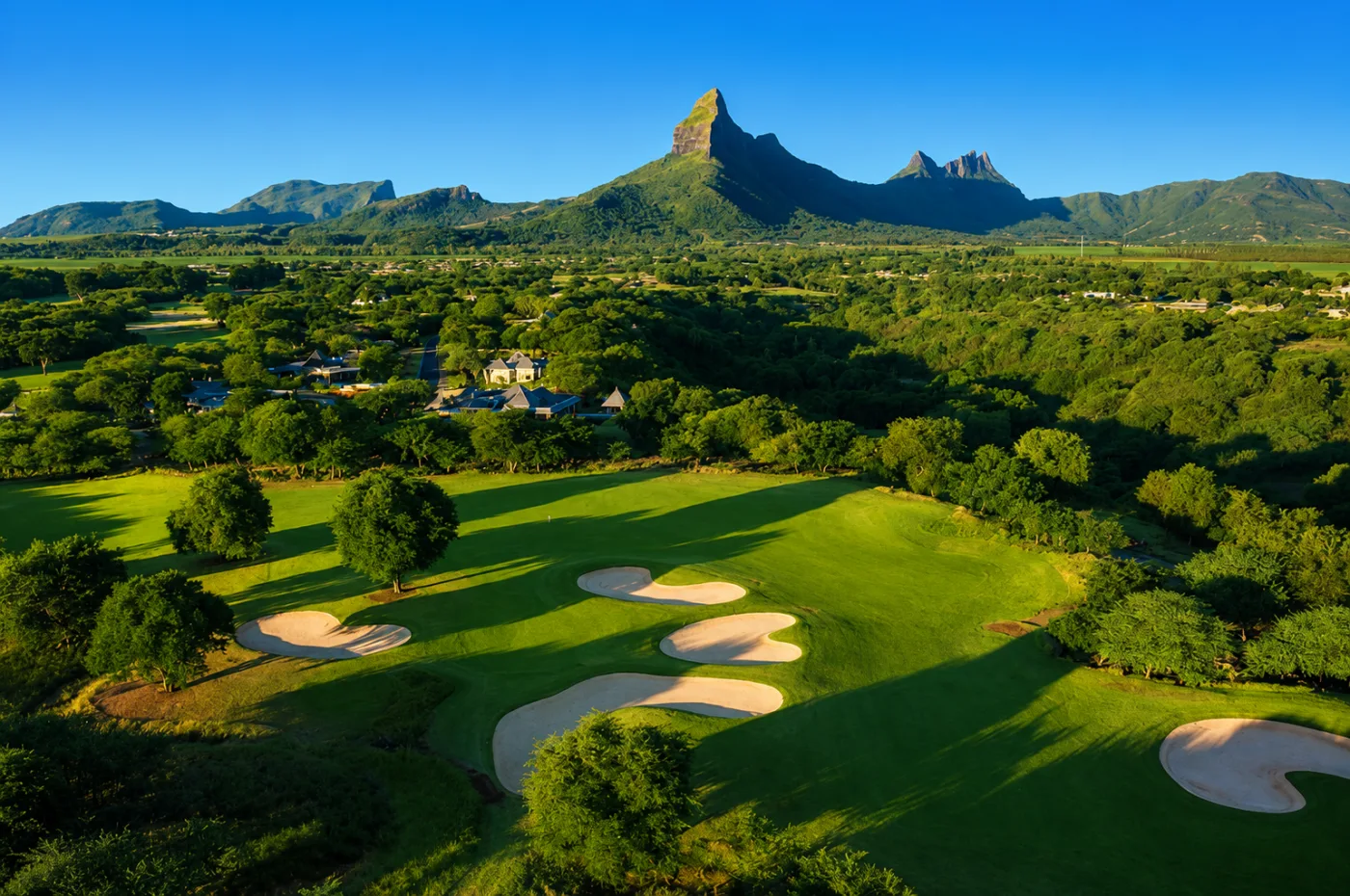 Tamarina 18-hole golf course with lake and the Montagne du Rempart, west coast of Mauritius